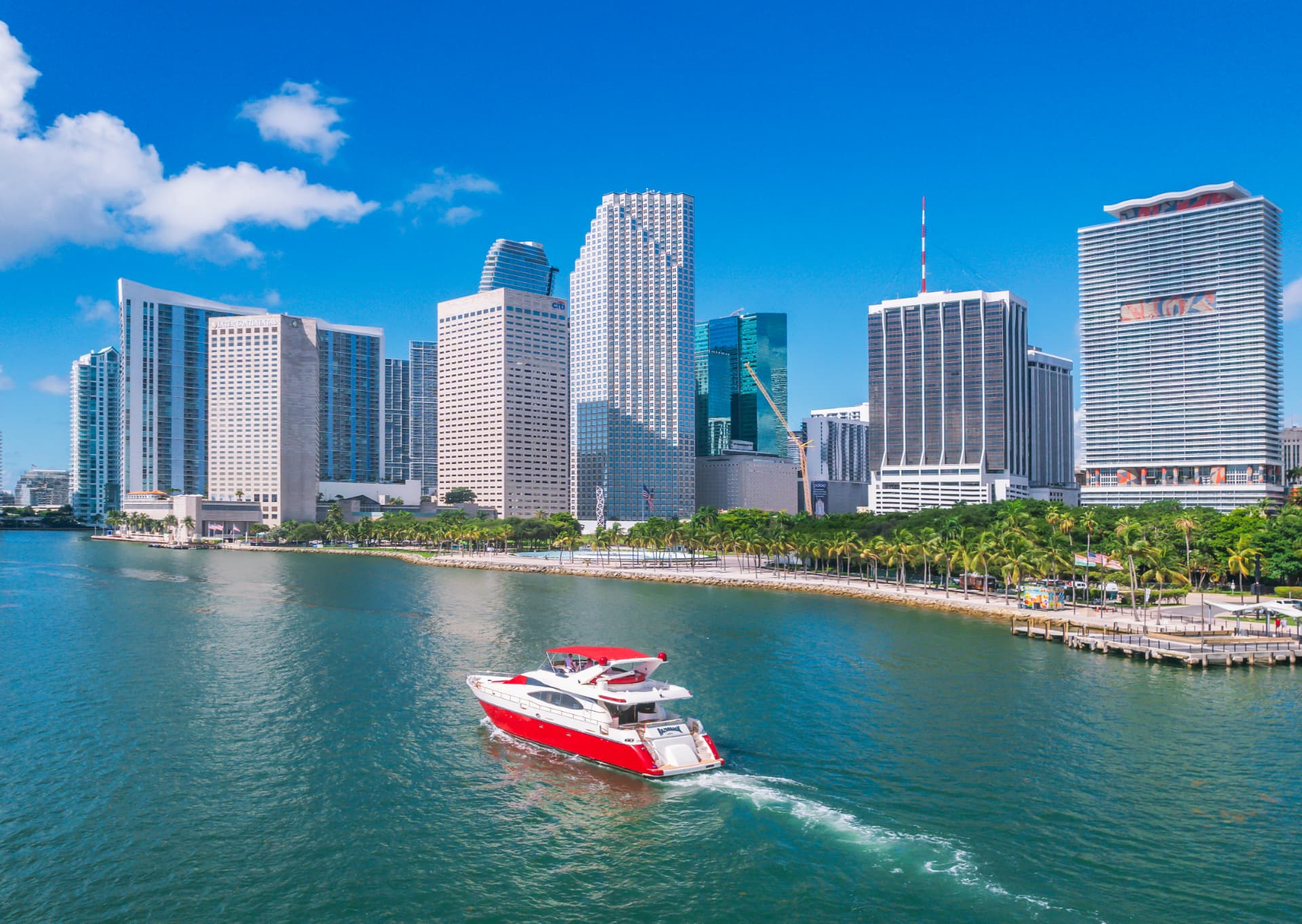 Private luxury yacht charter on Biscayne Bay at sunset in Miami